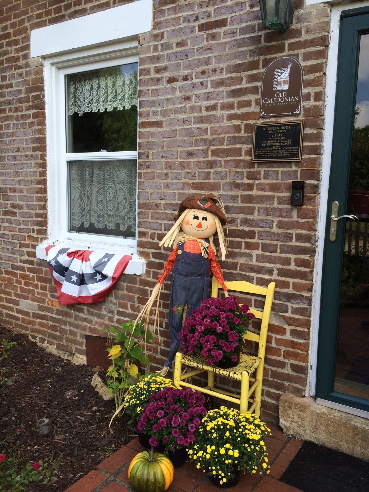 A cute scarecrow outside the entrance of the Old Caledonian