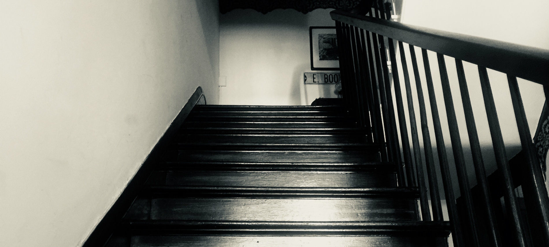 A spooky photo in black and white of the stairs at the OCBB