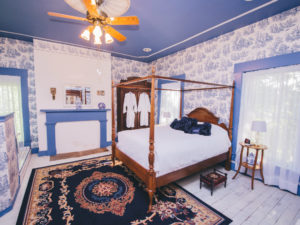 The Caroline Room, with a blue toile theme, is pictured.